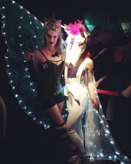 Heather Doerksen is attending party with her friend in unique costume.